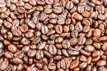 Brown roasted coffee beans , texture background