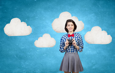 Hipster girl with photocamera
