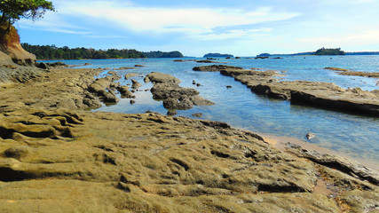Fototapeta na wymiar Rough rocky sea beach shore of Wandoor, Port Blair, Andaman and Nicobar Islands, India, Asia.