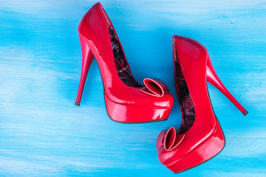 stylish fashion red female shoes on a blue background