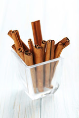 Cinnamon on a blue wooden background