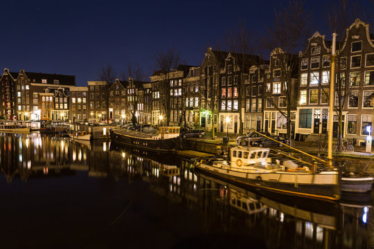 View along the Waalseilandgracht Canal in Amsterdam at night