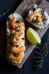 Sandwich with cream cheese, shrimp and herbs