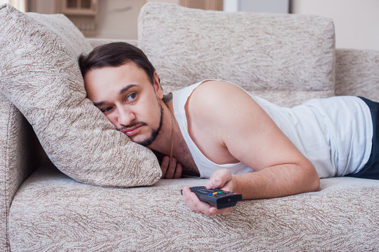 man with the beard carries out weekend on couch