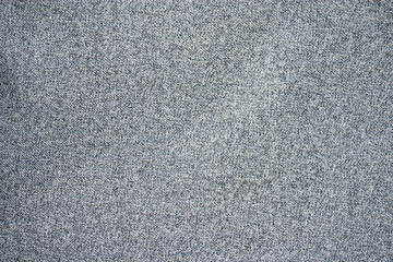 Fototapeta na wymiar texture of a piece of gray wool small knit