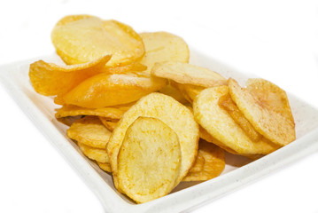 fried potatoes on a white plate in a restaurant