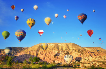 Colorful hot air balloon flying  in  blue sky  at Cappadocia ,Turkey 