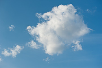 One large white cloud in blue sky