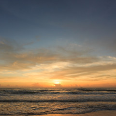 Naklejka na ściany i meble sunset dramatic sky with colorful cloud on the beach