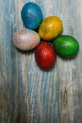 Easter eggs on wooden table. Holiday background