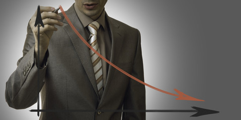 business concept. businessman drawing a graph down