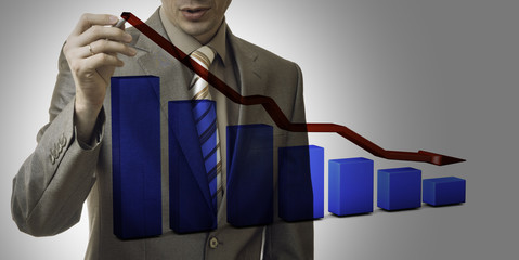 business concept. businessman drawing a graph down