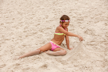 Little girl playing on beach