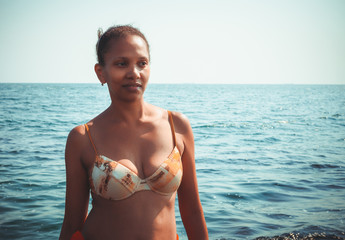 Beauty portrait of an African American black woman on a beach