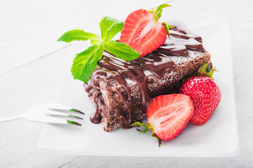 Chocolate cake with fresh strawberries