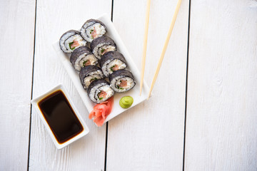 Salmon and cheese rolls on plate