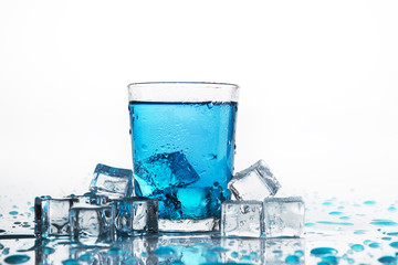 Water glass and cold ice cubes