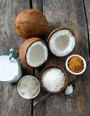Obraz na płótnie Canvas coconut sugar, milk and oil on wooden surface