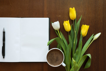 Blank book, tulips and coffee