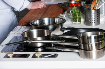 Restaurant food preparation, knives cutting boards.