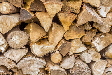 Fototapeta premium A stack of split logs being dried for firewood