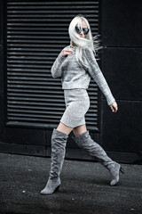 Stylish lovely young woman walking outdoors