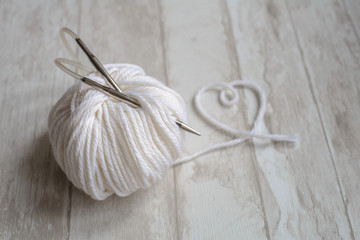 ball of yarn and shape heart sign