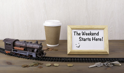 Train on railway, coffecup, money, keys and frame with text - Th