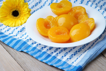 Cut peaches on the white dish