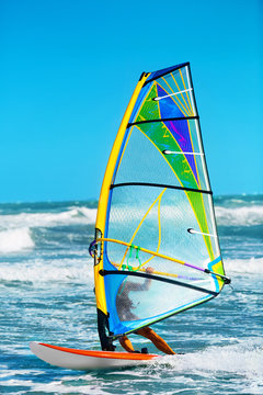 Recreational Water Sports. Windsurfing. Windsurfer Surfing The Wind On Waves In Ocean, Sea. Extreme Sport Action. Recreational Sporting Activity. Healthy Active Lifestyle. Summer Fun Adventure. Hobby