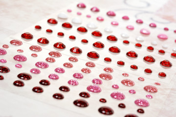 Rhinestones scattered on soft pink vintage background