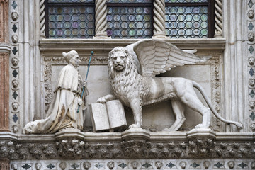 lion sculpture with book