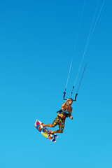 Kiteboarding, Kitesurfing. Water Sports. Professional Kite Surfer In Action In Air. Extreme Sport In Ocean. Healthy Active Lifestyle. Recreational Sporting Activity. Summer Fun, Hobby. Adrenaline.