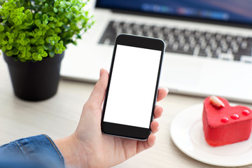 Women hand holding phone with isolated screen and notebook