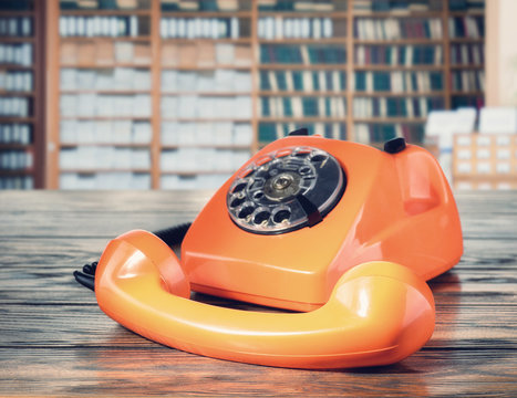 Orange vintage phone in the office
