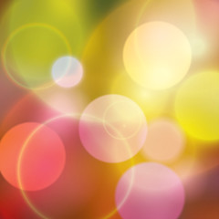 Colorful bokeh multi colored background with warm colors