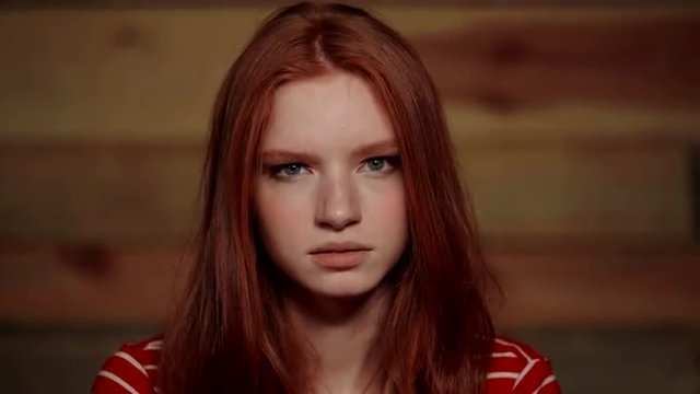 Beautiful redhead girl showing different emotions.