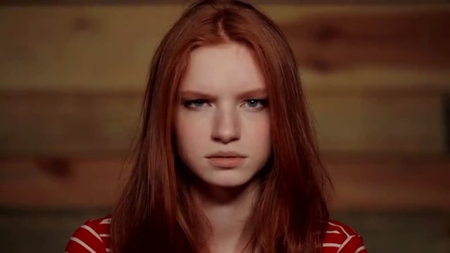 Beautiful redhead girl showing different emotions.