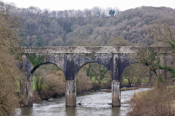 Fototapeta na wymiar Old stone bridge over the river Torridge in Devon, England