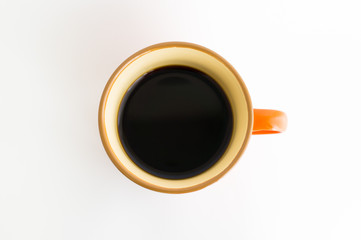オレンジ色のコーヒーカップ
