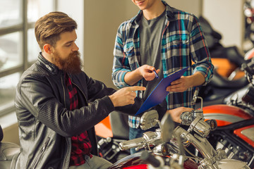 Men in motorbike salon