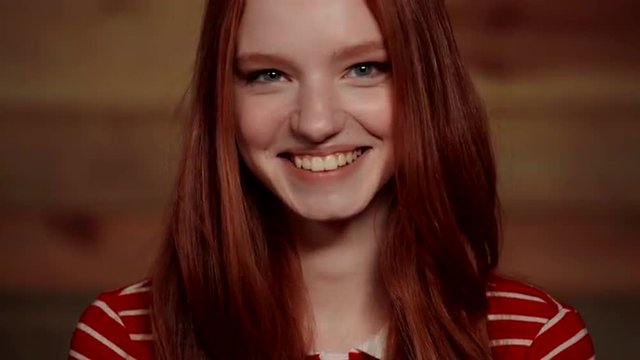 Beautiful redhead girl showing different emotions.
