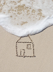 Home, drawing in the sand and surf