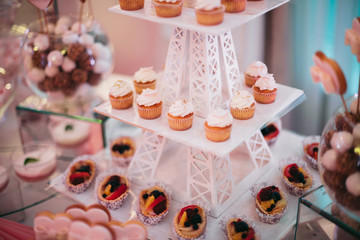 Different delicious desserts and cakes on the buffet table