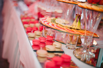Different delicious desserts and cakes on the buffet table