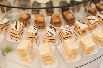 Different delicious desserts and cakes on the buffet table