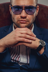 Aerious man in sunglasses.