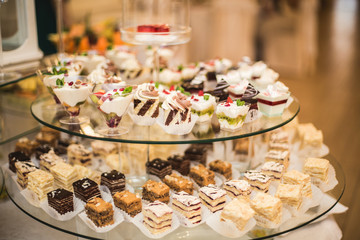 Different delicious desserts and cakes on the buffet table