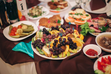 Various sweet sliced fruit on a buffet table