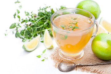 Green  tea with thyme and lime on white background